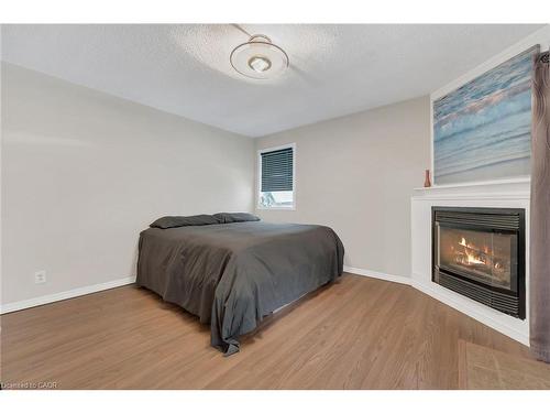 920 Highway 56, York, ON - Indoor Photo Showing Bedroom With Fireplace