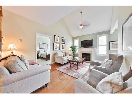 127-2125 Itabashi Way, Burlington, ON - Indoor Photo Showing Living Room With Fireplace