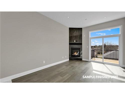 924 Garden Court Crescent, Woodstock, ON - Indoor With Fireplace