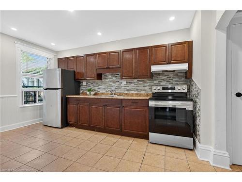 84 Ray Street S, Hamilton, ON - Indoor Photo Showing Kitchen With Double Sink