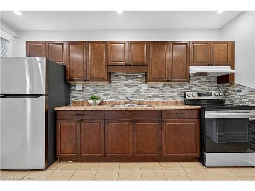 84 Ray Street S, Hamilton, ON - Indoor Photo Showing Kitchen With Double Sink