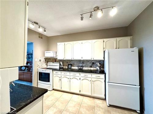1708-5250 Lakeshore Road, Burlington, ON - Indoor Photo Showing Kitchen With Double Sink