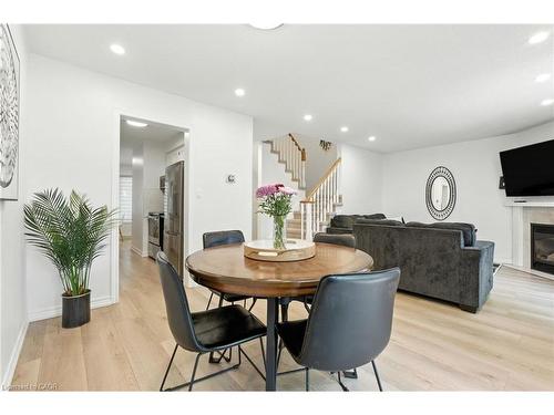 4-2252 Walkers Line, Burlington, ON - Indoor Photo Showing Dining Room With Fireplace