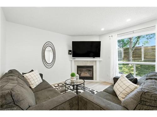 4-2252 Walkers Line, Burlington, ON - Indoor Photo Showing Living Room With Fireplace