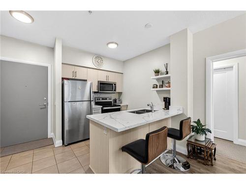 402-16 Concord Place, Grimsby, ON - Indoor Photo Showing Kitchen With Double Sink