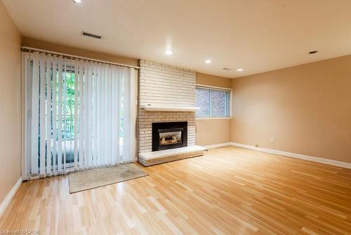 3-1556 Kerns Road, Burlington, ON - Indoor Photo Showing Living Room With Fireplace