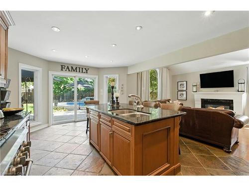 2139 Bushtrail Court, Burlington, ON - Indoor Photo Showing Kitchen With Fireplace With Double Sink