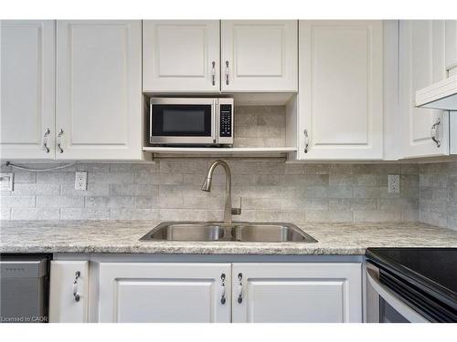 211-3499 Upper Middle Road, Burlington, ON - Indoor Photo Showing Kitchen With Double Sink