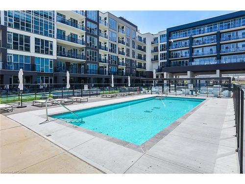 431-16 Concord Place, Grimsby, ON - Outdoor With In Ground Pool With Facade