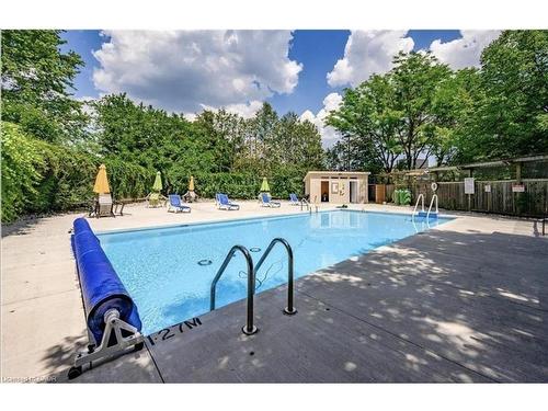 405-89 Westwood Road, Guelph, ON - Outdoor With In Ground Pool With Backyard