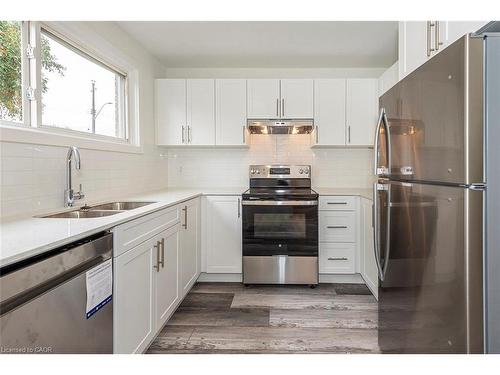 76 Woodman Drive N, Hamilton, ON - Indoor Photo Showing Kitchen With Stainless Steel Kitchen With Double Sink