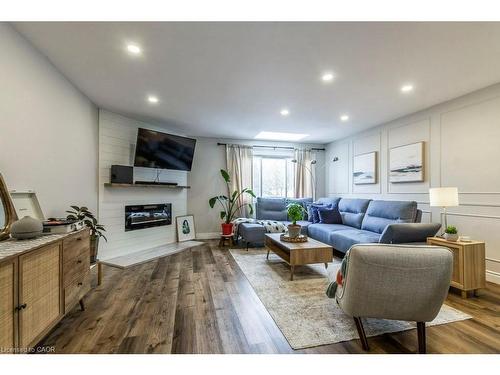 77-26 Moss Boulevard, Hamilton, ON - Indoor Photo Showing Living Room With Fireplace