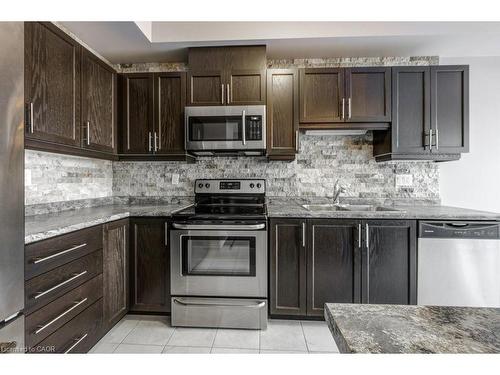 22-247 Festival Way, Binbrook, ON - Indoor Photo Showing Kitchen With Stainless Steel Kitchen With Double Sink