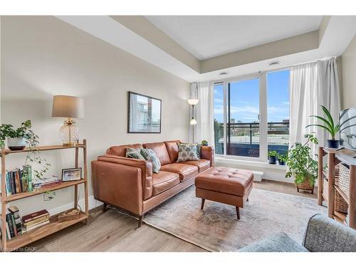 412-155 St. Leger Street, Kitchener, ON - Indoor Photo Showing Living Room With Fireplace