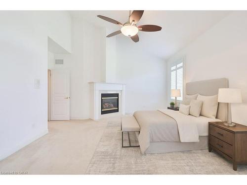 27-2165 Stavebank Road, Mississauga, ON - Indoor Photo Showing Bedroom With Fireplace