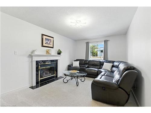 10 Shadowdale Drive, Stoney Creek, ON - Indoor Photo Showing Living Room With Fireplace