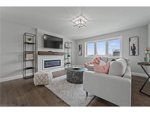 130 Stephenson Way, Minto, ON - Indoor Photo Showing Living Room With Fireplace
