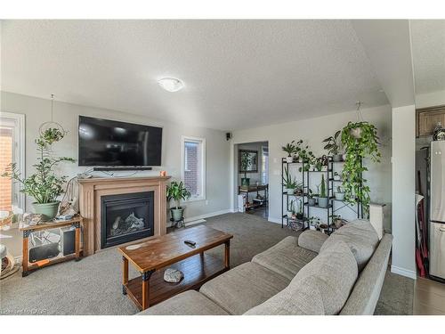 1384 Caen Avenue, Woodstock, ON - Indoor Photo Showing Living Room With Fireplace