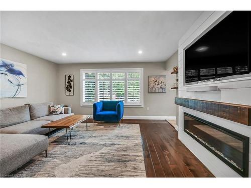 A-174 Kings Forest Drive, Hamilton, ON - Indoor Photo Showing Living Room With Fireplace