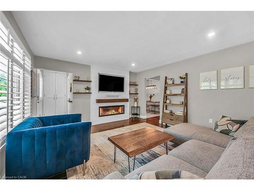 A-174 Kings Forest Drive, Hamilton, ON - Indoor Photo Showing Living Room With Fireplace