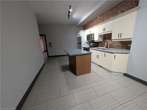 B-473 King Street W, Hamilton, ON - Indoor Photo Showing Kitchen With Double Sink