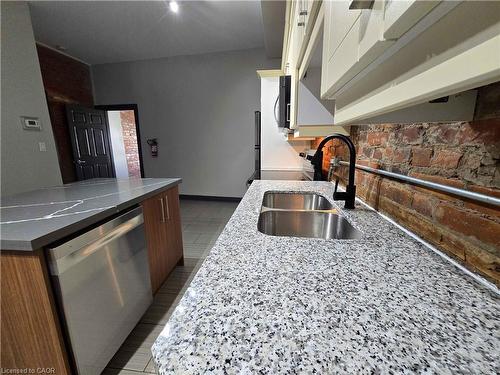 B-473 King Street W, Hamilton, ON - Indoor Photo Showing Kitchen With Double Sink