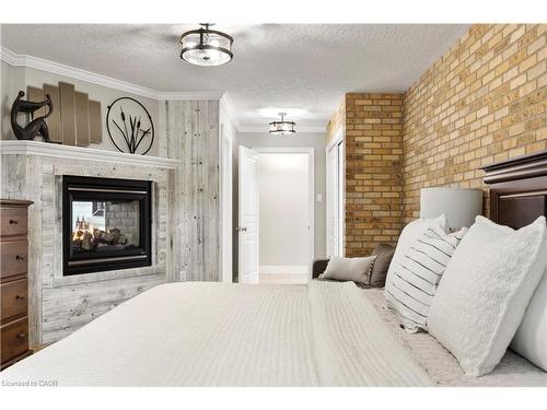 1794 Seaton Road, Cambridge, ON - Indoor Photo Showing Bedroom With Fireplace