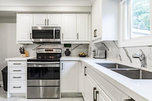 67 Gage Avenue N, Hamilton, ON - Indoor Photo Showing Kitchen With Double Sink