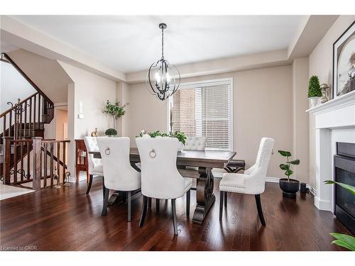 232 Shady Glen Crescent, Kitchener, ON - Indoor Photo Showing Dining Room With Fireplace