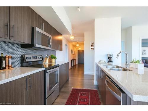 1603-55 Speers Road, Oakville, ON - Indoor Photo Showing Kitchen With Stainless Steel Kitchen With Double Sink With Upgraded Kitchen