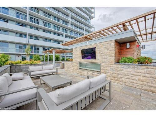 1603-55 Speers Road, Oakville, ON - Outdoor With Fireplace