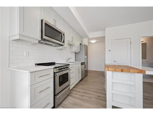 202-247 Northfield Drive E, Waterloo, ON - Indoor Photo Showing Kitchen With Upgraded Kitchen