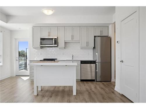 202-247 Northfield Drive E, Waterloo, ON - Indoor Photo Showing Kitchen With Upgraded Kitchen