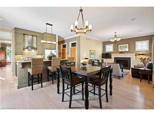 52 Garrison Village Drive, Niagara-On-The-Lake, ON - Indoor Photo Showing Dining Room With Fireplace