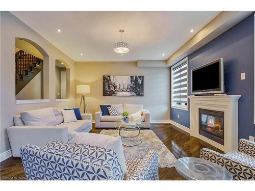317 Great Lakes Boulevard, Oakville, ON - Indoor Photo Showing Living Room With Fireplace