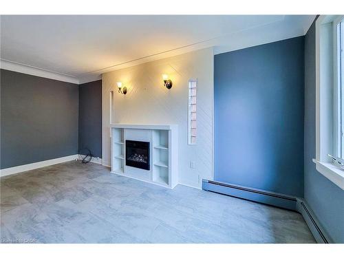 156 Park Row S, Hamilton, ON - Indoor With Fireplace