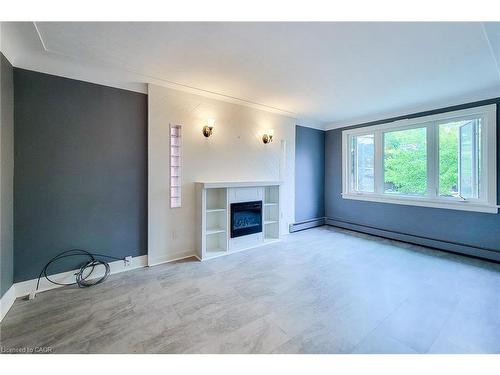 156 Park Row S, Hamilton, ON - Indoor Photo Showing Living Room With Fireplace