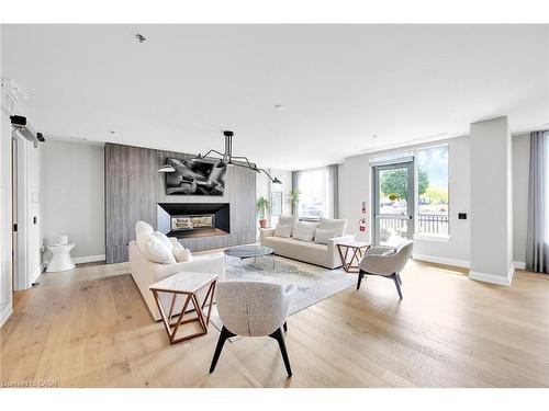 301-121 Highway 8, Stoney Creek, ON - Indoor Photo Showing Living Room With Fireplace