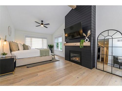 2560 2 Side Road, Burlington, ON - Indoor Photo Showing Bedroom With Fireplace