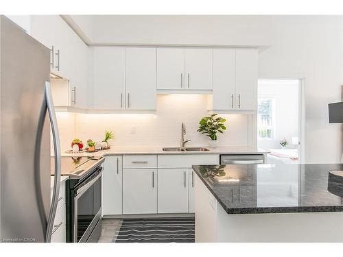 102-251 Northfield Drive E, Waterloo, ON - Indoor Photo Showing Kitchen With Stainless Steel Kitchen With Double Sink With Upgraded Kitchen