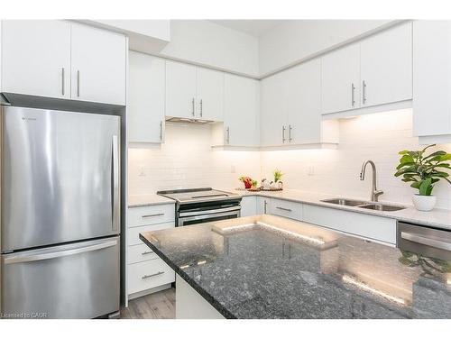 102-251 Northfield Drive E, Waterloo, ON - Indoor Photo Showing Kitchen With Stainless Steel Kitchen With Double Sink With Upgraded Kitchen