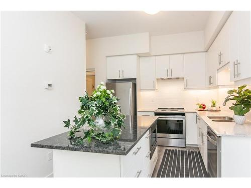 102-251 Northfield Drive E, Waterloo, ON - Indoor Photo Showing Kitchen With Stainless Steel Kitchen With Double Sink With Upgraded Kitchen