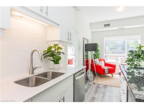 102-251 Northfield Drive E, Waterloo, ON - Indoor Photo Showing Kitchen With Double Sink