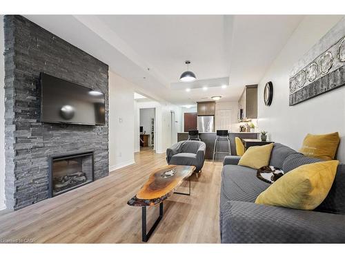 102-70 Stewart Street, Oakville, ON - Indoor Photo Showing Living Room With Fireplace