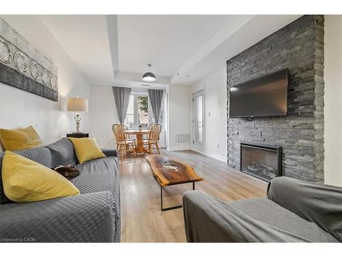 102-70 Stewart Street, Oakville, ON - Indoor Photo Showing Living Room With Fireplace