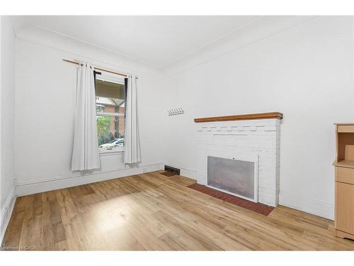 1-73 Stirton Street, Hamilton, ON - Indoor Photo Showing Other Room With Fireplace
