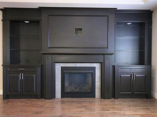 Upper-16 Riva Court, Hamilton, ON - Indoor Photo Showing Living Room With Fireplace