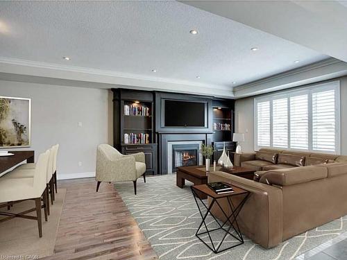 Upper-16 Riva Court, Hamilton, ON - Indoor Photo Showing Living Room With Fireplace