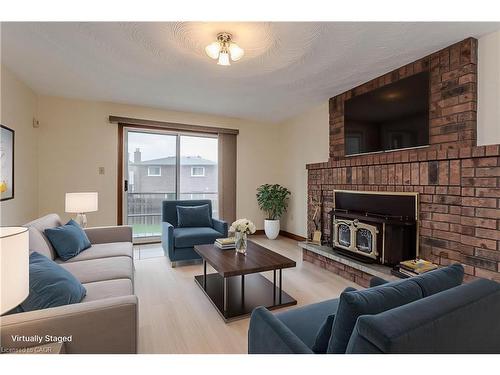 18 Marcel Place, Hamilton, ON - Indoor Photo Showing Living Room With Fireplace