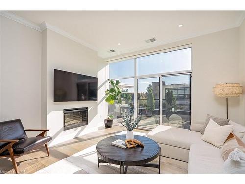 202-1878 Gordon Street, Guelph, ON - Indoor Photo Showing Living Room With Fireplace